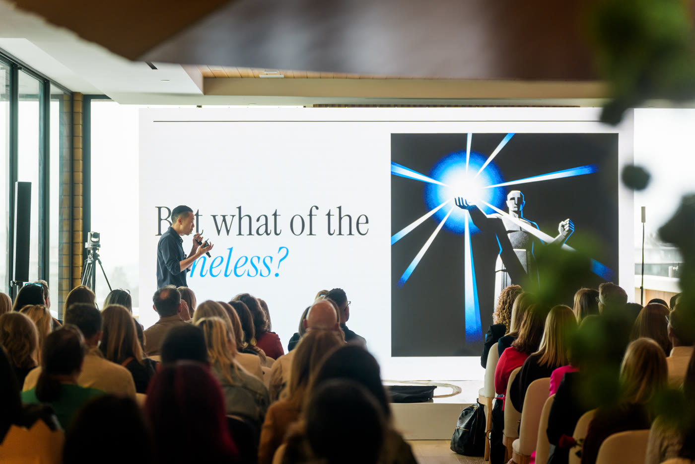 A CPOHQ leader speaking to an intimate executive audience