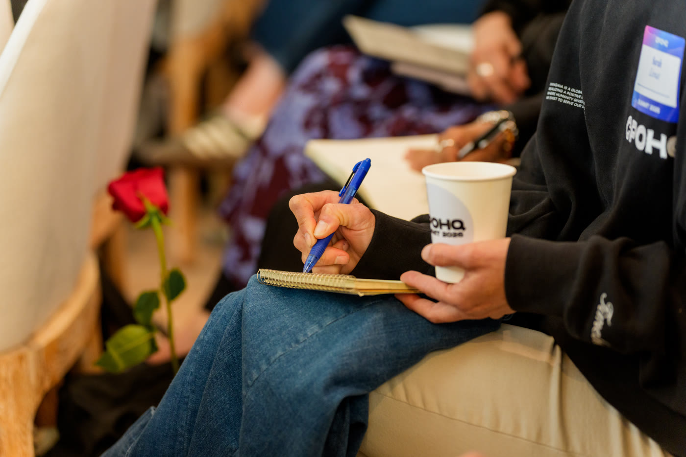A CPOHQ member taking notes during an executive coaching session
