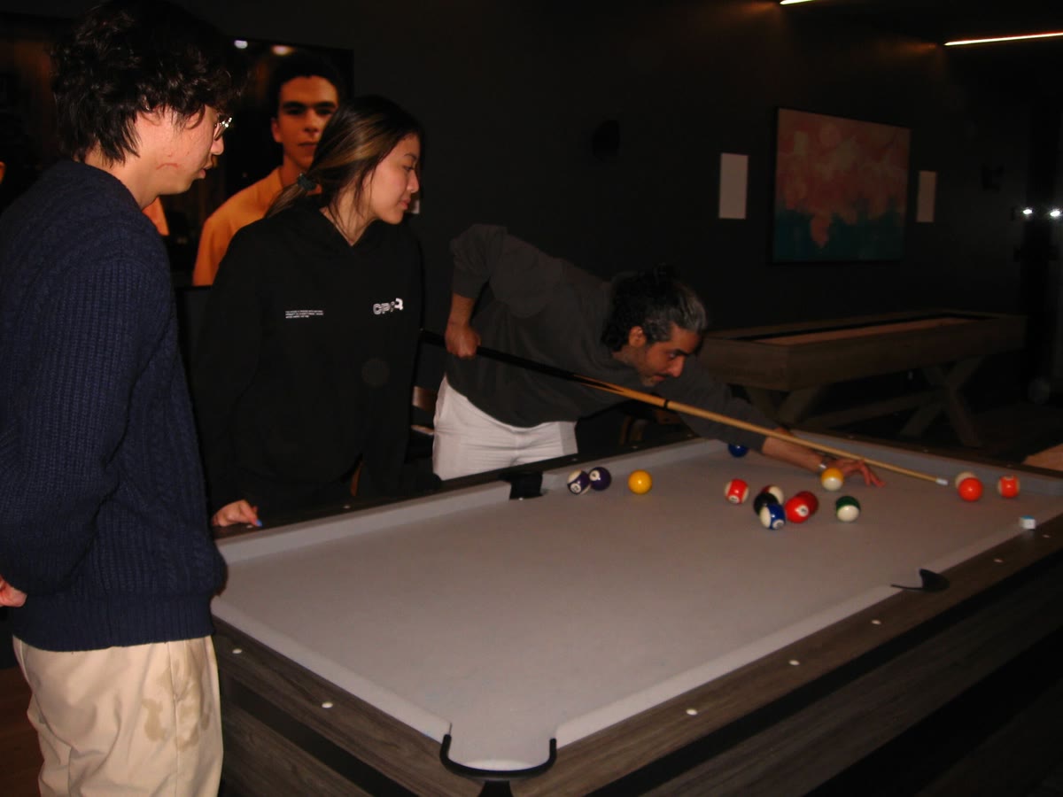 CPOHQ teammates playing pool together