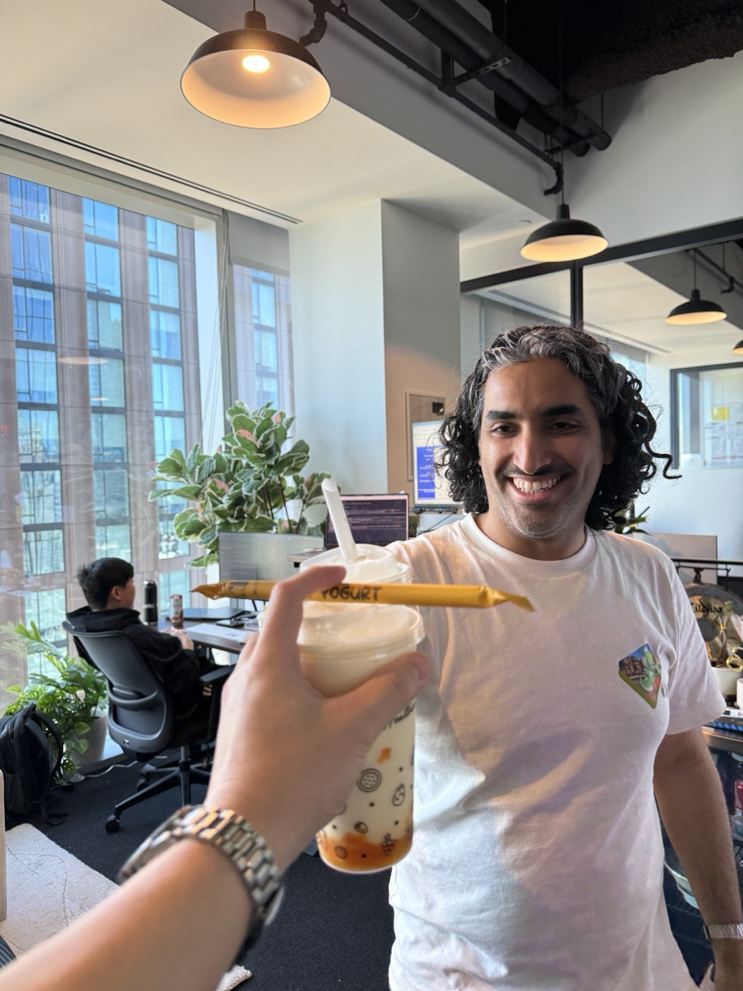 A teammate on a bubble tea break in the office