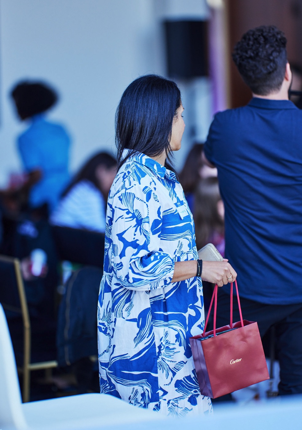 A guest with a Cartier gift bag at Summit