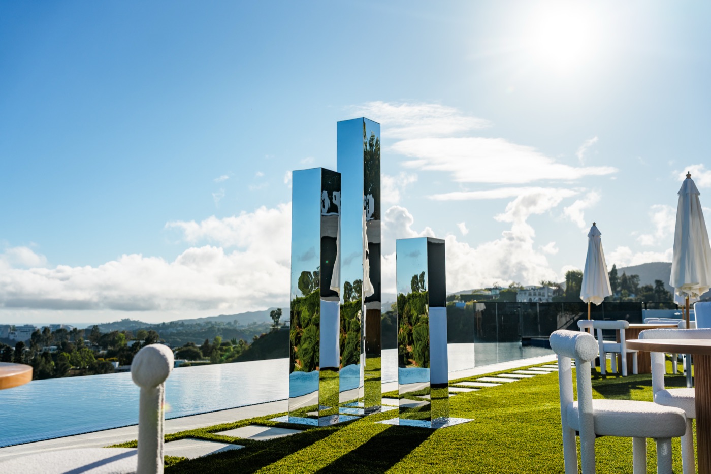 Mirror installations by the infinity pool at Summit