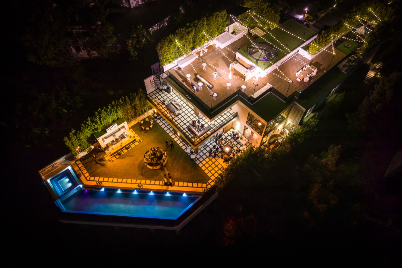 The Summit venue lit up at night from above