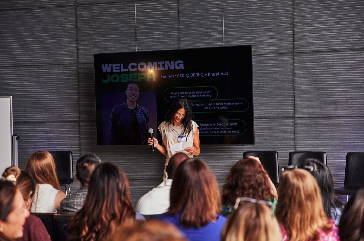 Welcoming Joseph on stage at a CPOHQ event