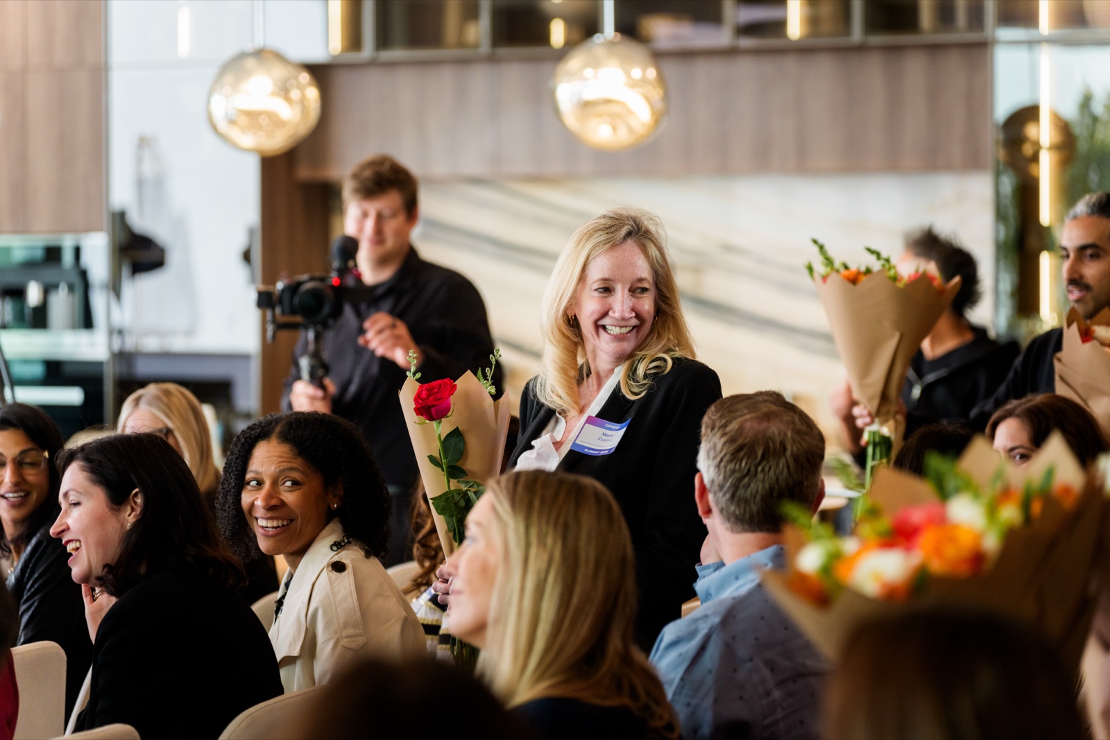 CPOHQ attendees celebrating with roses